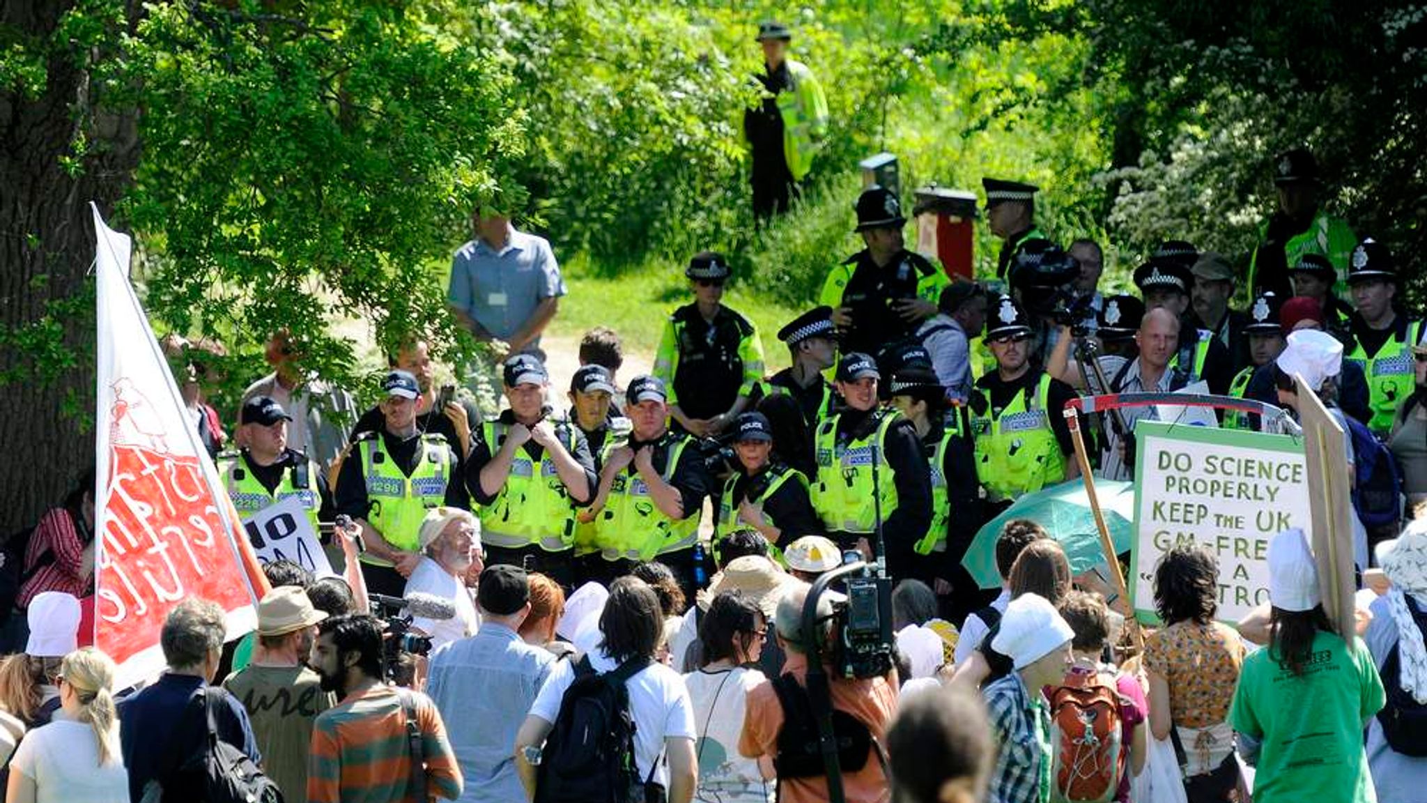 Police shield the GM wheat trial at Rothamsted from protesters
